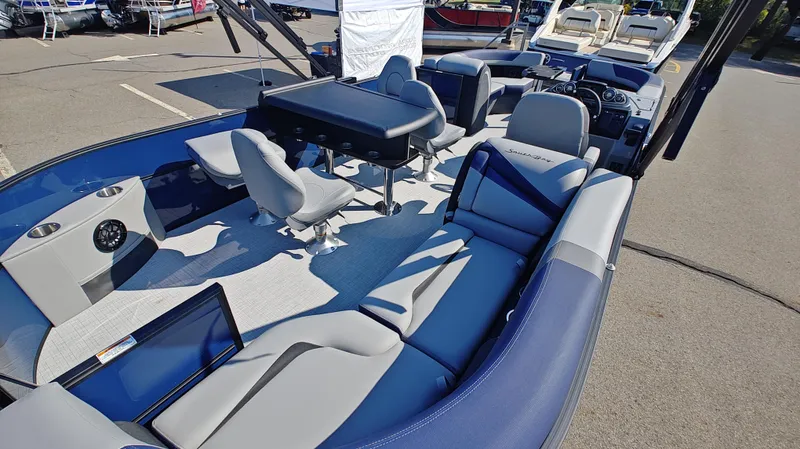 Slide: The Image of 2025 South Bay 224E 3.0 pontoon boat interior with seating and table. - 5