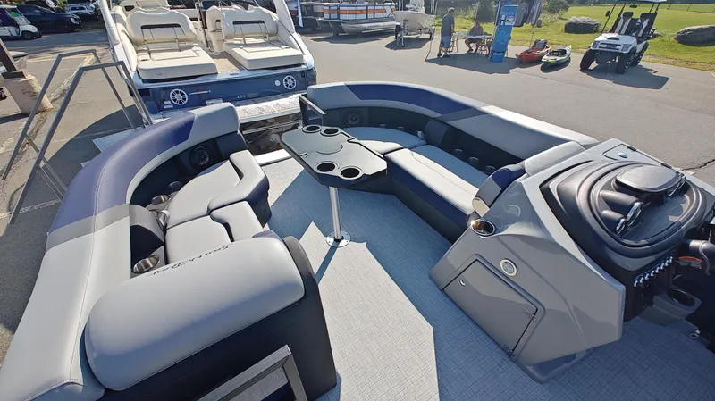 Slide: The Image of 2025 South Bay 224E 3.0 pontoon boat interior with seating and control console. - 8