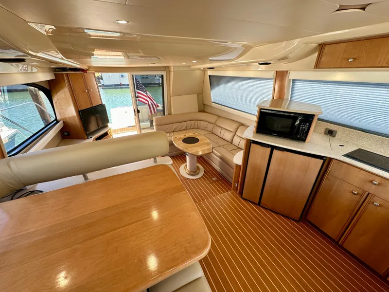 Slide: The Image of Luxurious interior of 2003 Meridian 411 Sedan yacht with wood finishes and modern amenities. - 14