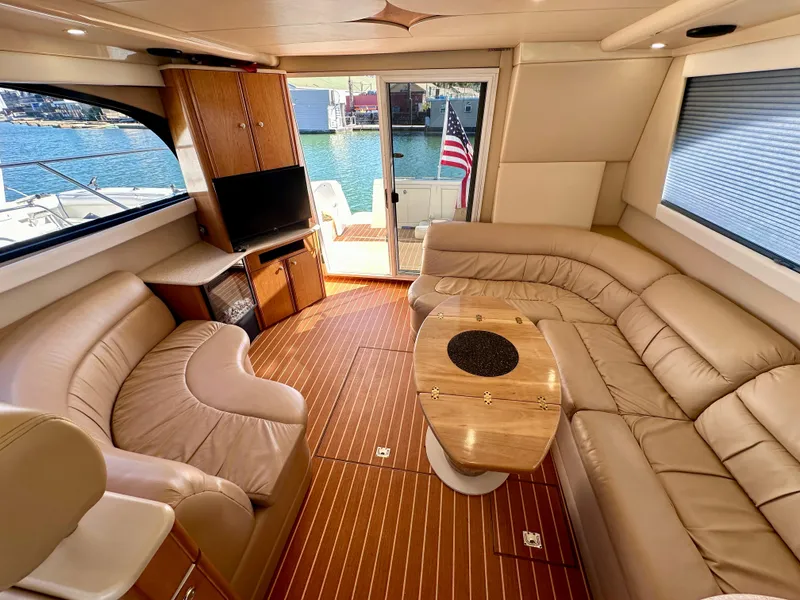 Slide: The Image of Luxurious interior of 2003 Meridian 411 Sedan yacht with leather seating and wood flooring. - 16
