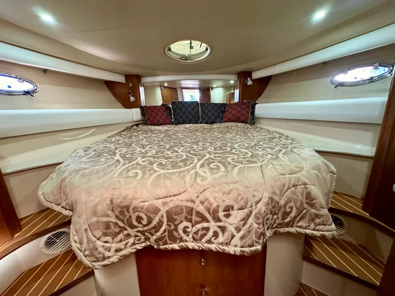 Slide: The Image of Luxurious bedroom interior of 2003 Meridian 411 Sedan yacht with elegant bedding. - 18