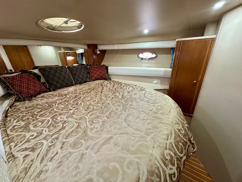 Slide: The Image of Luxurious bedroom interior of 2003 Meridian 411 Sedan yacht with elegant bedding. - 19