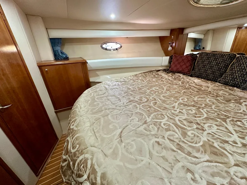 Slide: The Image of Luxurious cabin interior of 2003 Meridian 411 Sedan yacht with elegant bedding. - 20