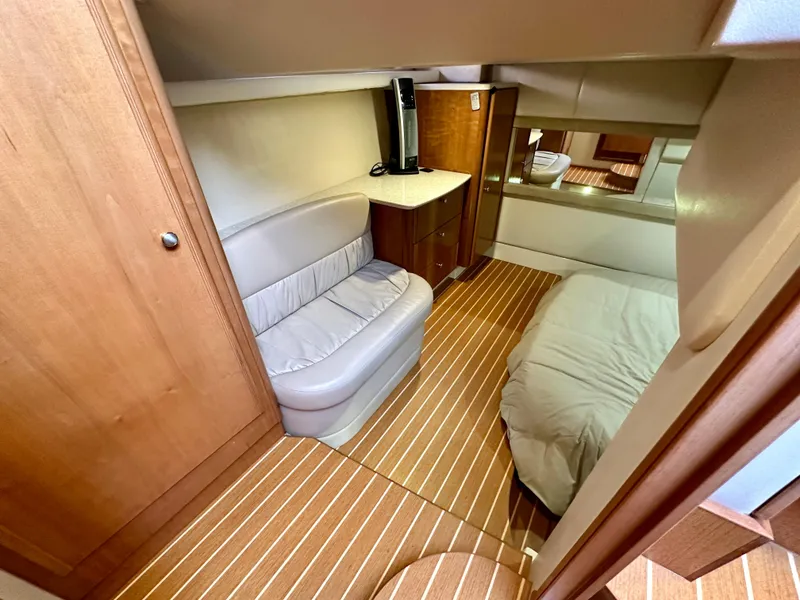 Slide: The Image of Interior of 2003 Meridian 411 Sedan yacht with cozy seating and bed. - 23