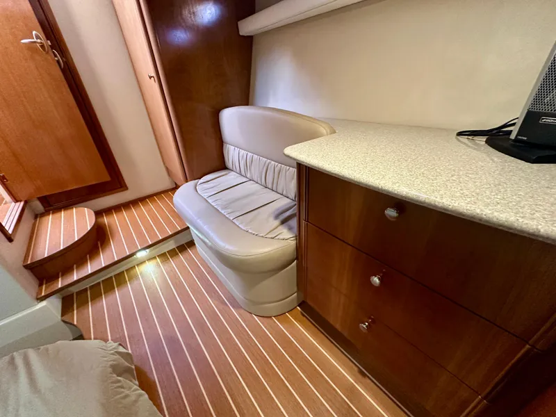 Slide: The Image of Interior of 2003 Meridian 411 Sedan with wooden cabinetry and striped flooring. - 26