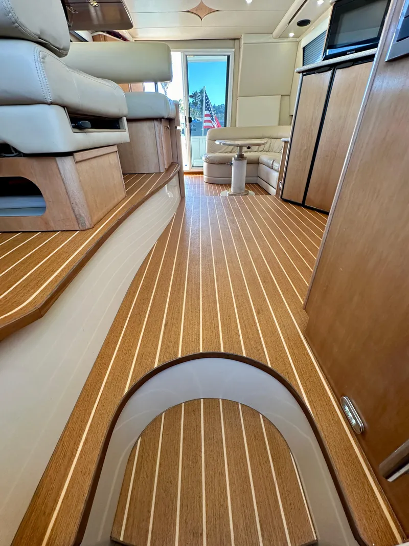 Slide: The Image of Interior of 2003 Meridian 411 Sedan yacht with elegant wood flooring and modern furnishings. - 27
