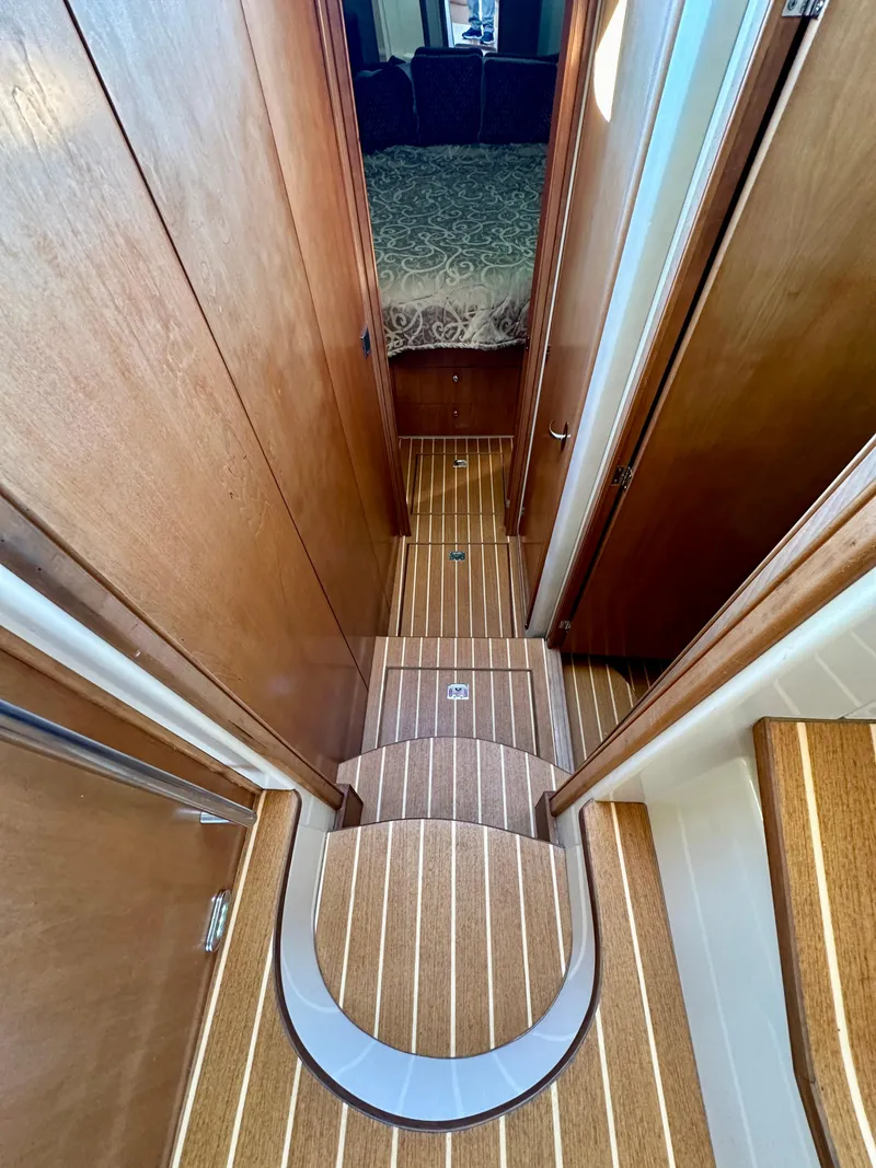 Slide: The Image of Interior hallway of 2003 Meridian 411 Sedan yacht with wooden flooring. - 28