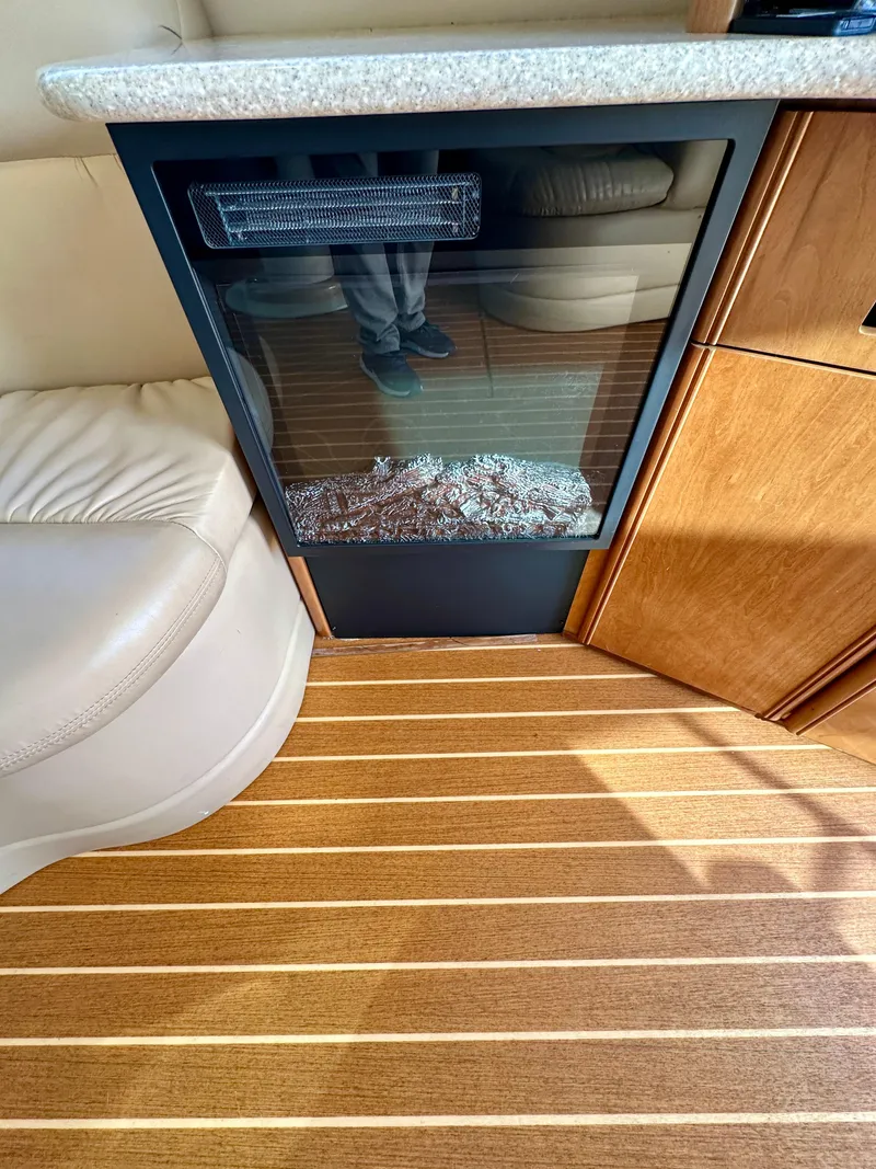 Slide: The Image of Interior of a 2003 Meridian 411 Sedan with wood flooring and seating. - 29