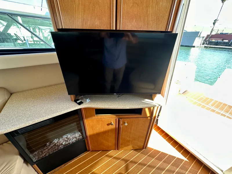 Slide: The Image of Interior of 2003 Meridian 411 Sedan with TV and wooden cabinetry. - 30
