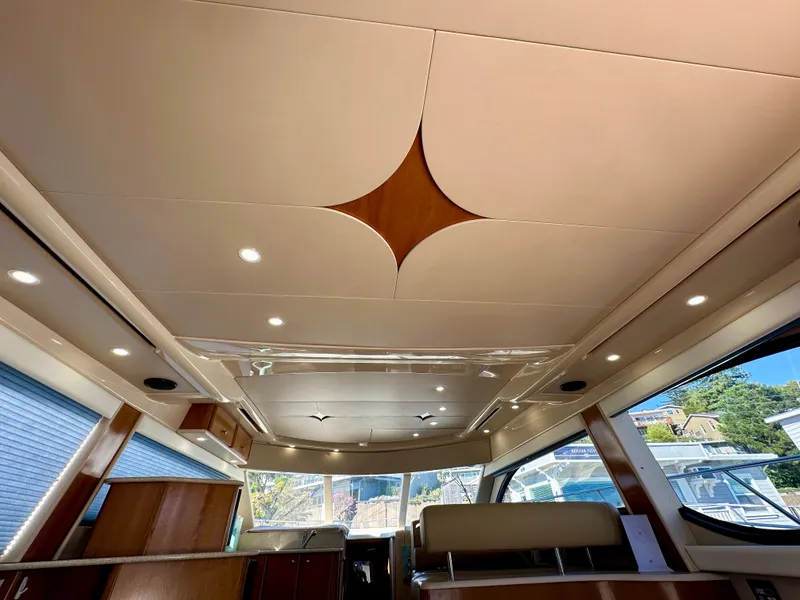 Slide: The Image of Interior of 2003 Meridian 411 Sedan yacht with modern ceiling design and ambient lighting. - 31