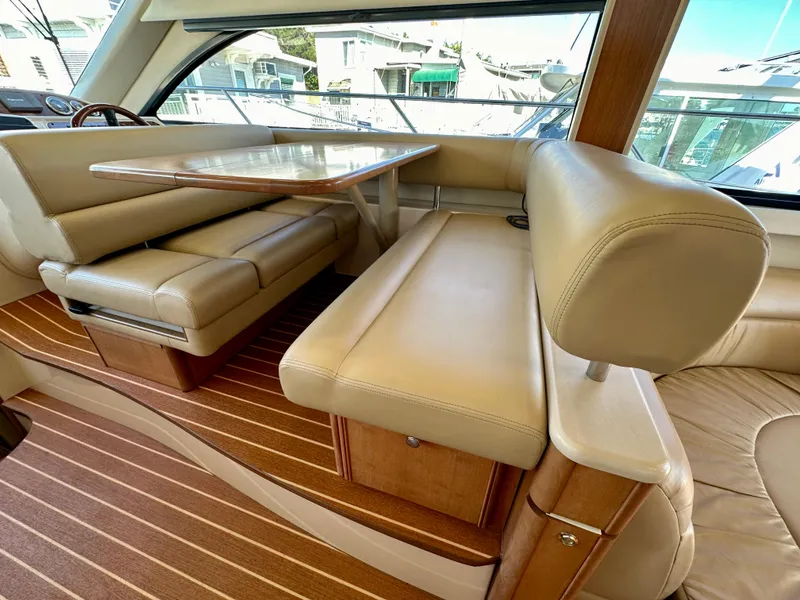 Slide: The Image of Luxurious interior of 2003 Meridian 411 Sedan yacht with beige leather seating. - 34