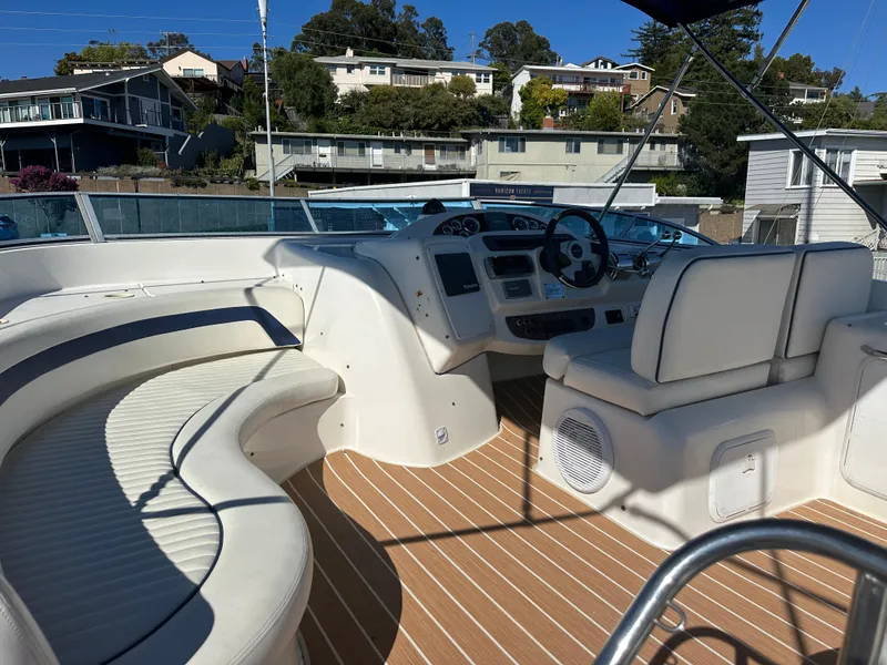 Slide: The Image of 2003 Meridian 411 Sedan yacht interior with white seating and wooden flooring. - 38