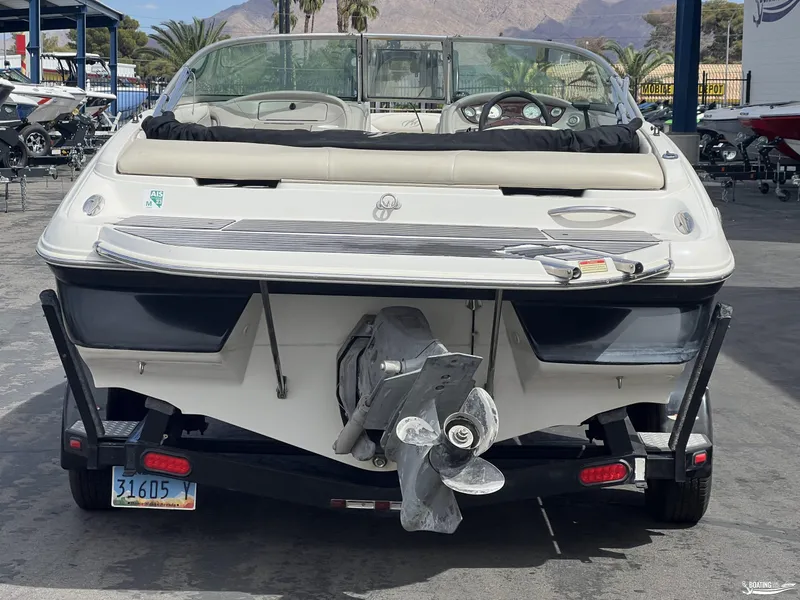 Slide: The Image of 2004 Monterey Montura 190 LS boat on trailer, rear view, in a marina setting. - 3