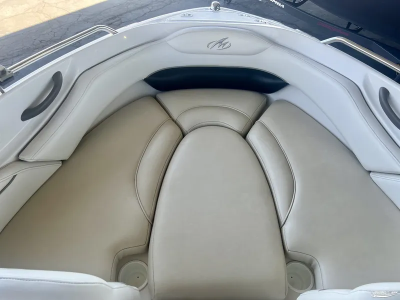 Slide: The Image of 2004 Monterey Montura 190 LS boat interior with beige cushioned seating. - 5