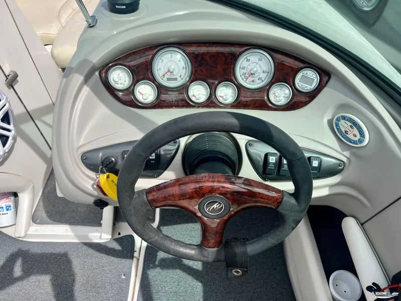 Slide: The Image of 2004 Monterey Montura 190 LS boat dashboard with gauges and steering wheel. - 7