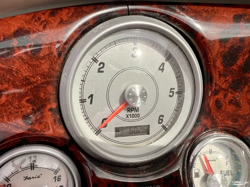 Slide: The Image of 2004 Monterey Montura 190 LS dashboard with RPM gauge and woodgrain finish. - 8