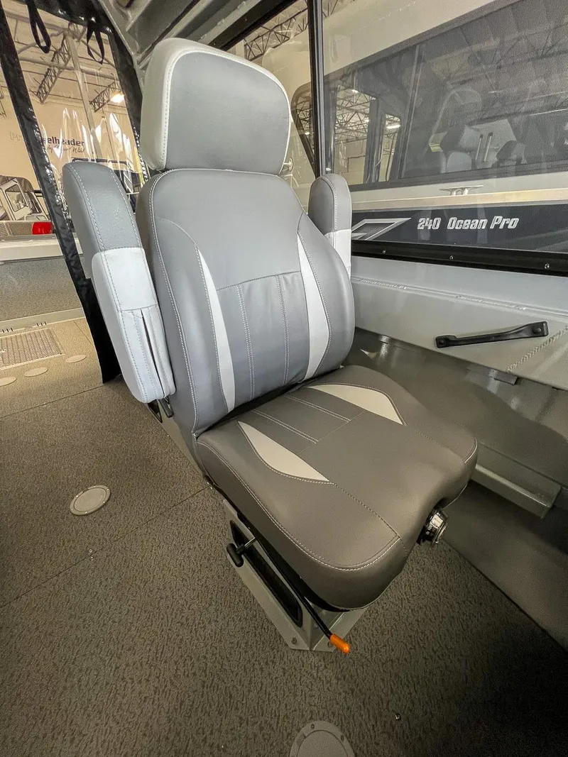 Slide: The Image of 2024 Hewescraft 210 Sea Runner ET HT interior seat, gray upholstery, modern design. - 10