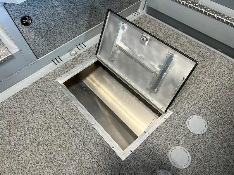 Slide: The Image of 2024 Hewescraft 210 Sea Runner ET HT boat storage compartment, open and empty. - 15