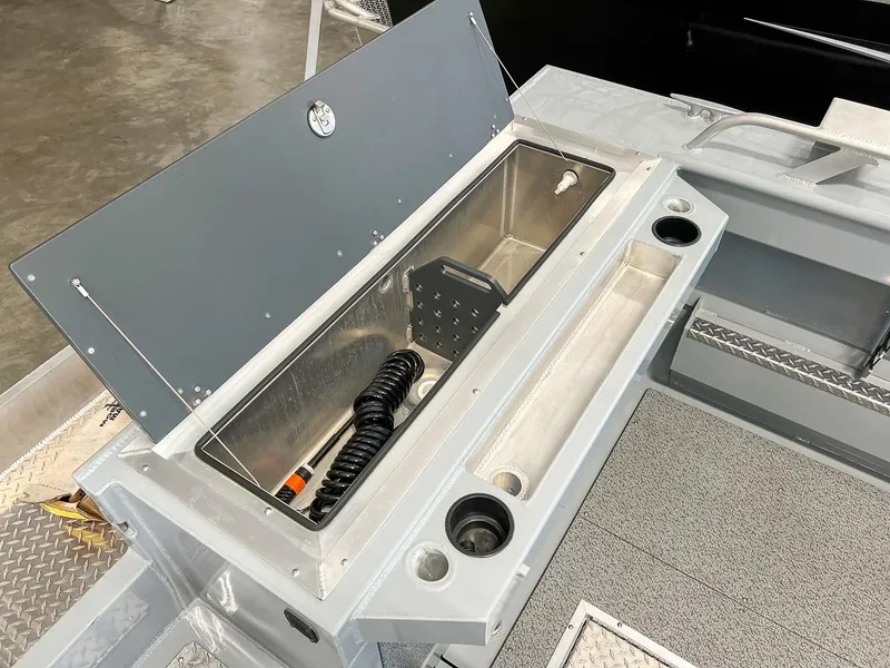 Slide: The Image of 2024 Hewescraft 210 Sea Runner ET HT boat interior storage compartment. - 16