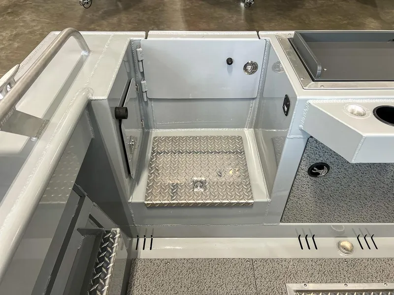 Slide: The Image of 2024 Hewescraft 210 Sea Runner ET HT interior with diamond plate flooring and storage compartments. - 17