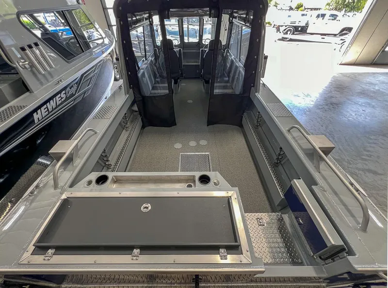 Slide: The Image of 2024 Hewescraft 210 Sea Runner ET HT boat interior, showcasing spacious seating and modern design. - 19