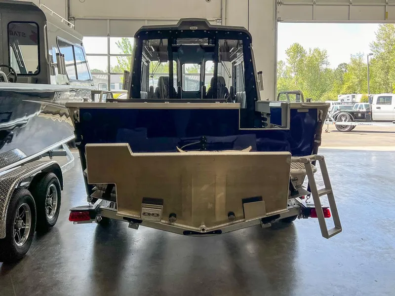 Slide: The Image of 2024 Hewescraft 210 Sea Runner ET HT boat in showroom, rear view. - 4