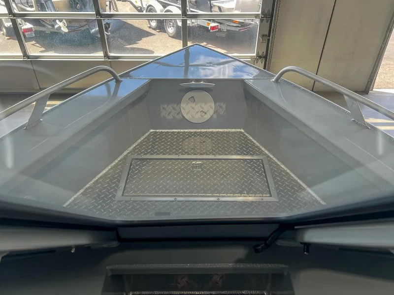 Slide: The Image of 2024 Hewescraft 210 Sea Runner ET HT boat interior with diamond plate flooring. - 5