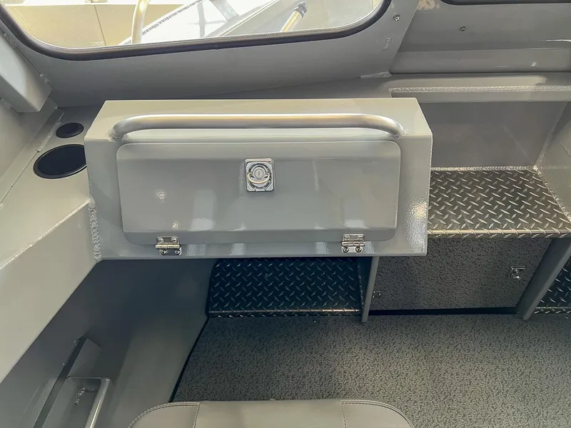 Slide: The Image of 2024 Hewescraft 210 Sea Runner ET HT interior storage compartment with diamond plate flooring. - 8