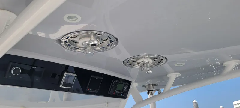 Slide: The Image of 2022 Valhalla V-33 Center Console dashboard with Fusion audio system. - 15