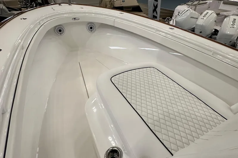 Slide: The Image of 2022 Valhalla V-33 Center Console boat interior with storage compartments and seating. - 22