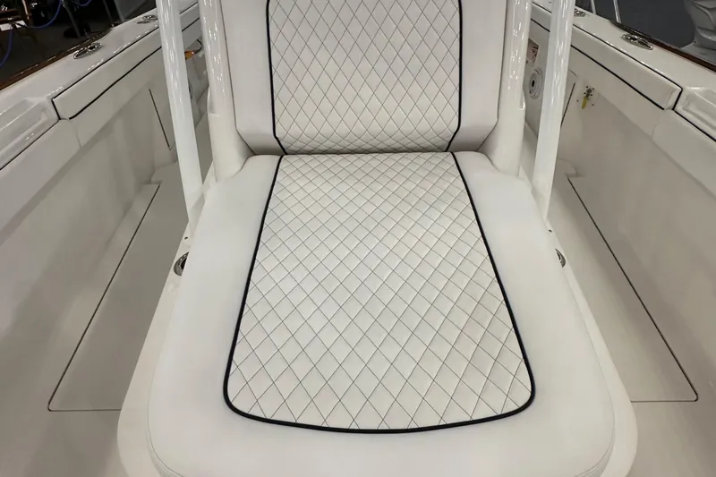 Slide: The Image of 2022 Valhalla V-33 Center Console boat with dual outboard engines, sleek white design. - 23