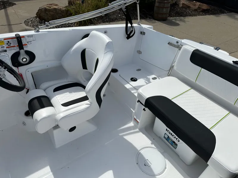 Slide: The Image of 2024 Tahoe 1950 boat interior with white and black seating, modern design. - 10