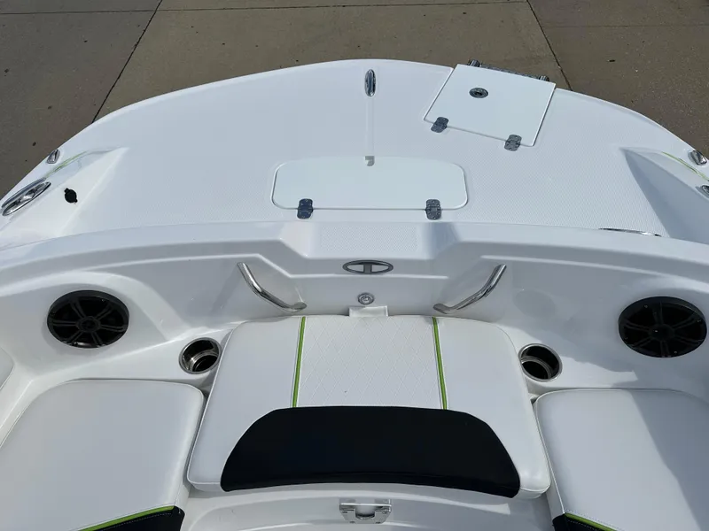 Slide: The Image of 2024 Tahoe 1950 boat interior with white seating and green accents. - 3