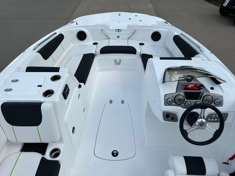 Slide: The Image of 2024 Tahoe 1950 boat interior with sleek design and modern dashboard. - 4