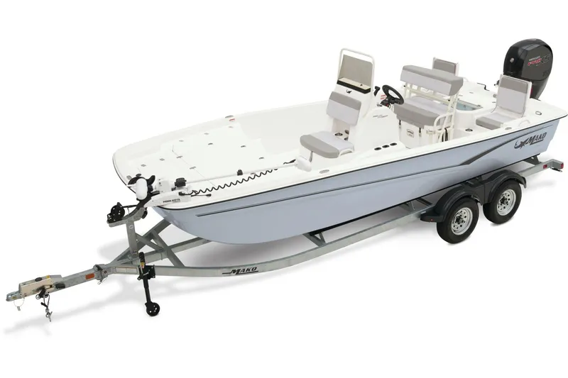 Slide: The Image of 2024 Mako Pro Skiff 19 CC boat deck with calm water backdrop. - 14
