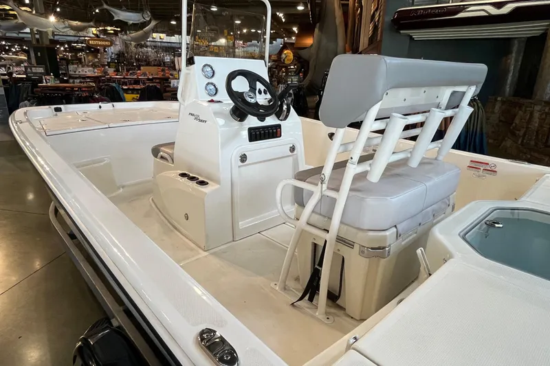 Slide: The Image of 2024 Mako Pro Skiff 19 CC boat hull detail with trailer attachment. - 5