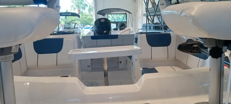 Slide: The Image of 2024 Tahoe 1950 boat interior with seating and table, showcasing modern design and comfort. - 3