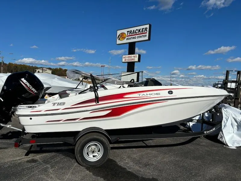 Slide: The Image of 2024 Tahoe T18 boat at Tracker Boating Center under clear blue sky. - 0