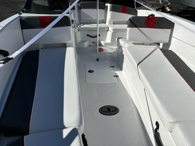 Slide: The Image of 2024 Tahoe T18 boat interior with white and gray seating, red accents, and spacious layout. - 3