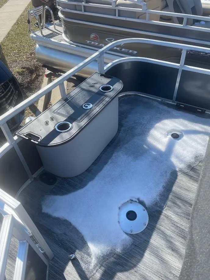 Slide: The Image of 2024 Ranger Reata 220F boat interior with seating and storage compartments. - 2