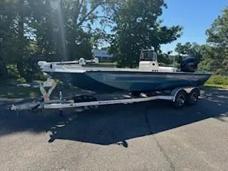 The Image of 2024 Ranger RB200 boat on trailer, parked outdoors in sunny setting. - 0
