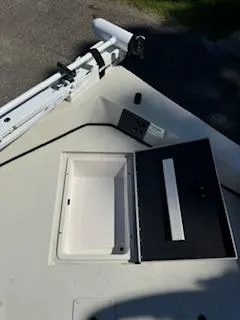 Slide: The Image of 2024 Ranger RB200 boat deck with open storage compartment and mounted equipment. - 2