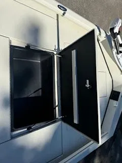 Slide: The Image of 2024 Ranger RB200 boat storage compartment with open hatch. - 3