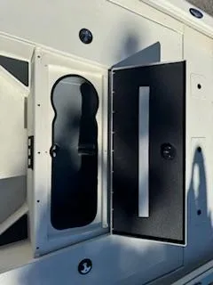 Slide: The Image of 2024 Ranger RB200 boat storage compartment with open hatch, showcasing interior design. - 5