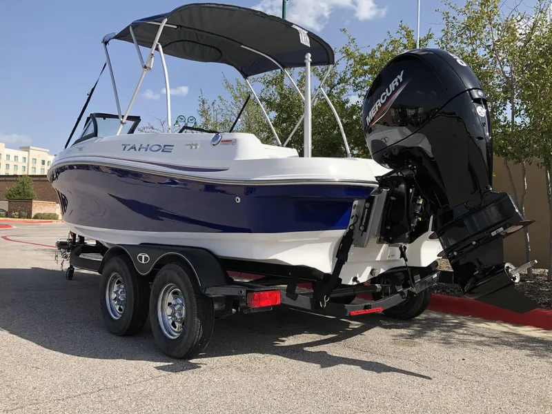 Slide: The Image of 2024 Tahoe 200 S boat with Mercury outboard engine on trailer. - 46