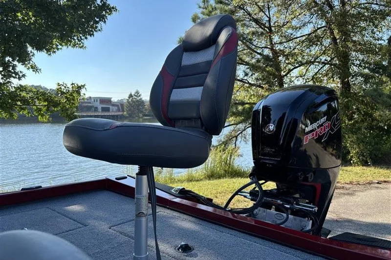 Slide: The Image of 2024 Ranger RT188P boat seat and Mercury Pro XS engine by a lake. - 18