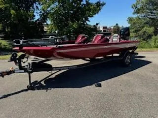 The Image of 2024 Ranger RT188P boat on trailer, red color, parked outdoors. - 1