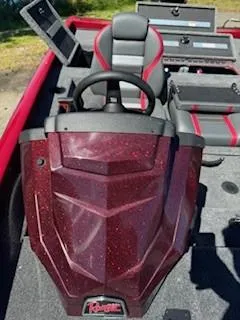 Slide: The Image of 2024 Ranger RT188P boat interior with red accents and steering wheel. - 2