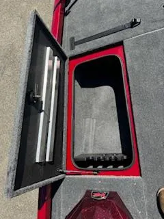 Slide: The Image of 2024 Ranger RT188P boat storage compartment with open lid, showcasing interior space. - 4