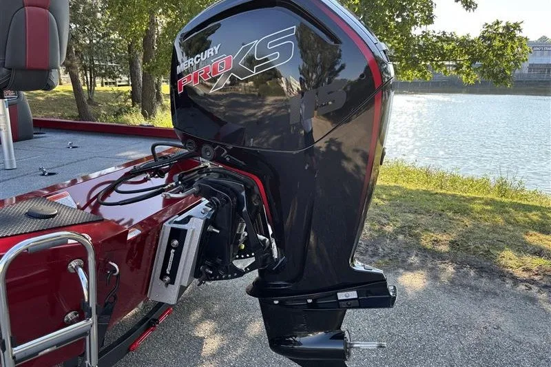 Slide: The Image of 2024 Ranger RT188P boat with Mercury Pro XS outboard motor by a lake. - 8